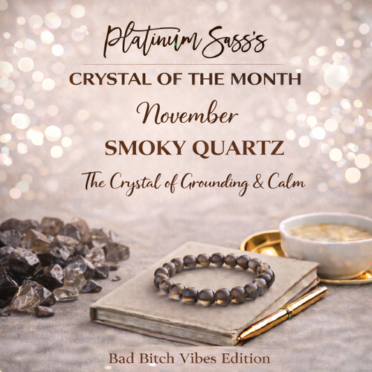 Platinum Sass Crystal of the Month November — Smoky Quartz bracelet on a journal with raw smoky quartz crystals